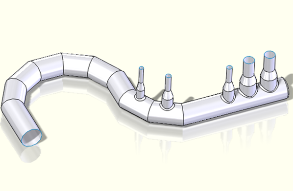 This complex duct shape was made with a few simple solid modeling commands and then turned into a shell model by removing a few faces at the end of the pipes.